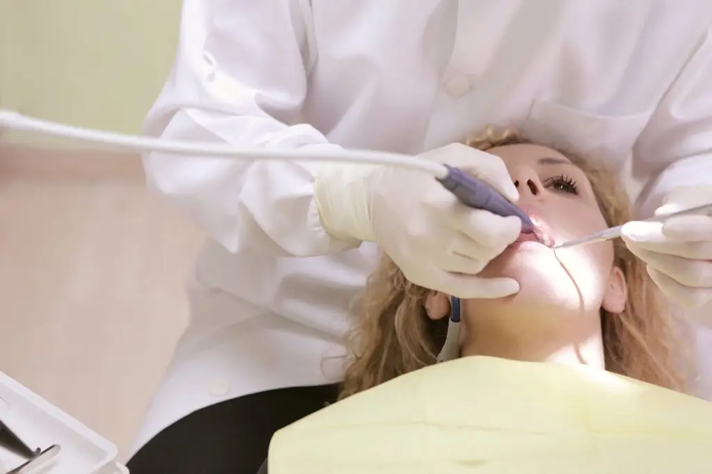 Hygenist cleaning teeth