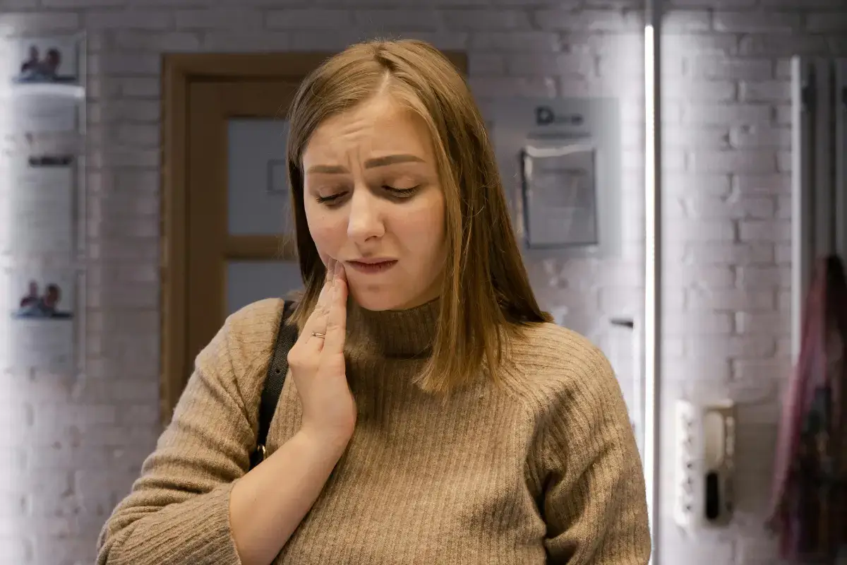 women feeling Pain After Dental Filling